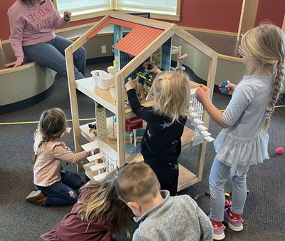 wooden play house with three levels