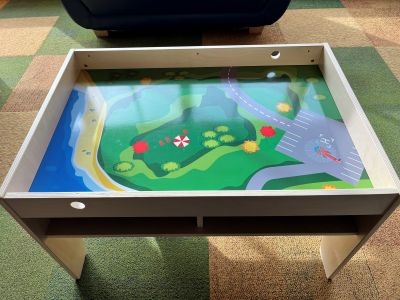 wood table with printed town 