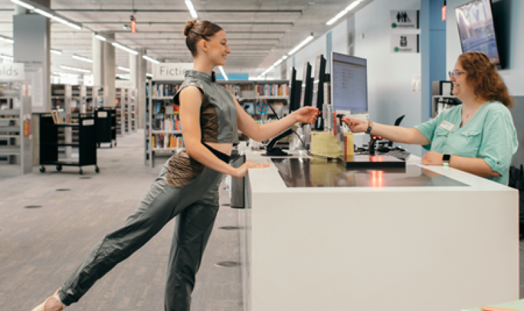 ballerina at the library desk